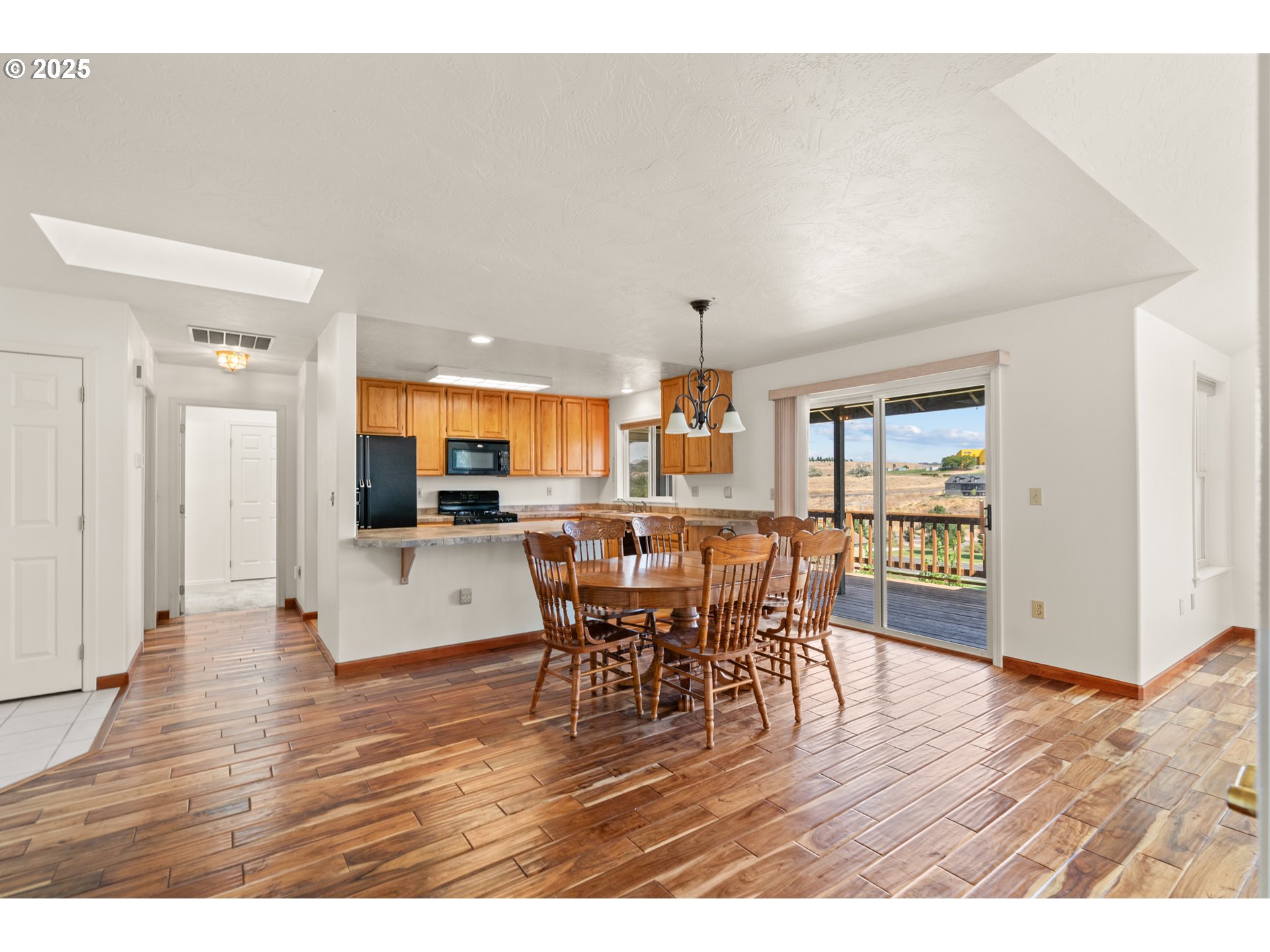 1837 Southwest Athens Avenue Pendleton, OR 97801 - Photo 13 of 42 a view of a dining room with furniture and wooden floor