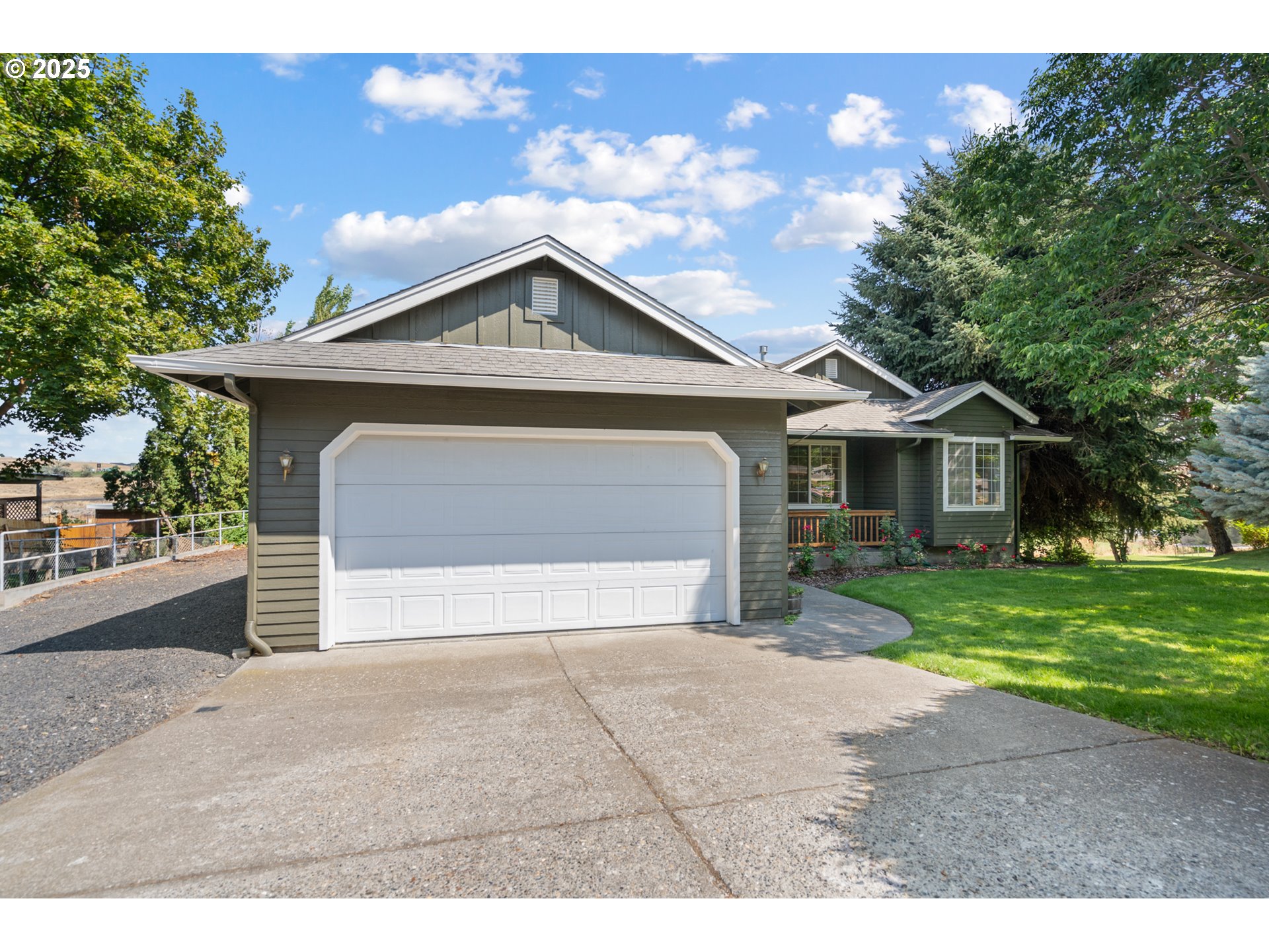 1837 Southwest Athens Avenue Pendleton, OR 97801 - Photo 2 of 42 a front view of a house with a yard and garage