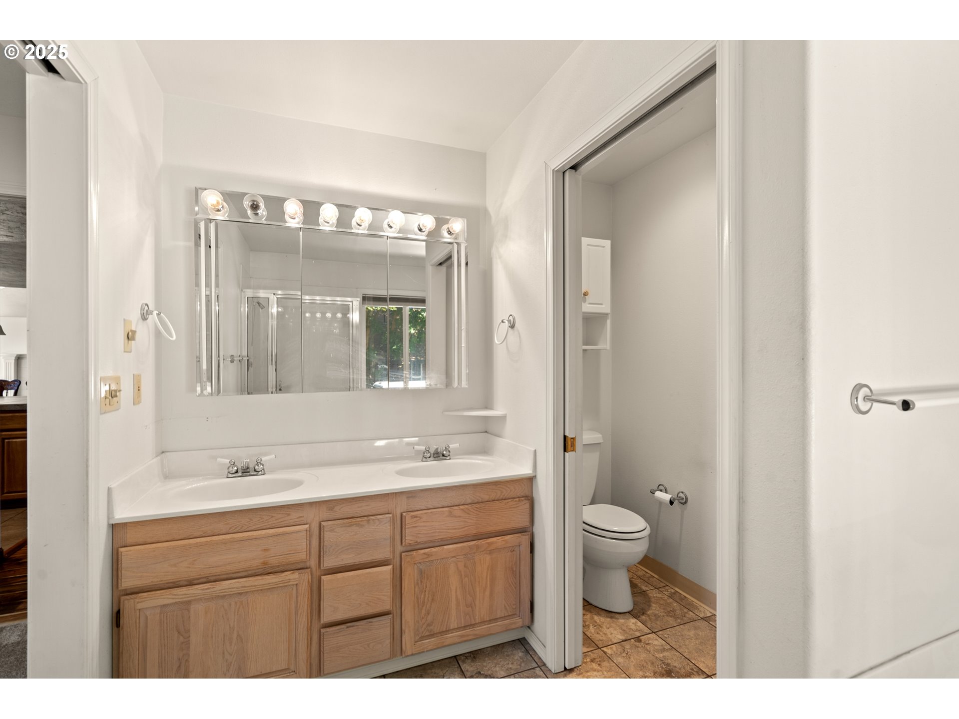 1837 Southwest Athens Avenue Pendleton, OR 97801 - Photo 21 of 42 a bathroom with a sink a toilet a large mirror and shower