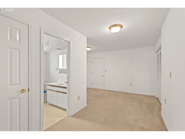 a bathroom with a sink a toilet and a window