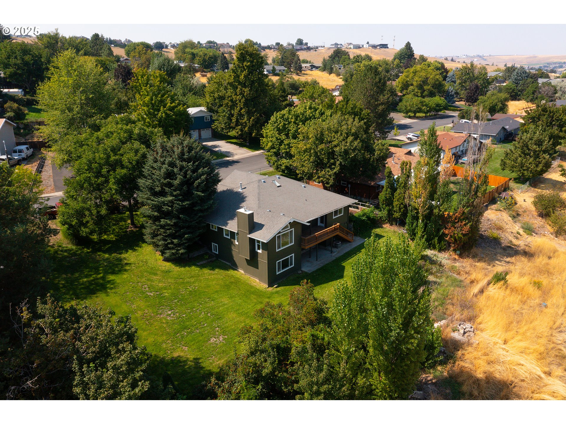 1837 Southwest Athens Avenue Pendleton, OR 97801 - Photo 5 of 42 a aerial view of a house with a yard basket ball court and outdoor seating