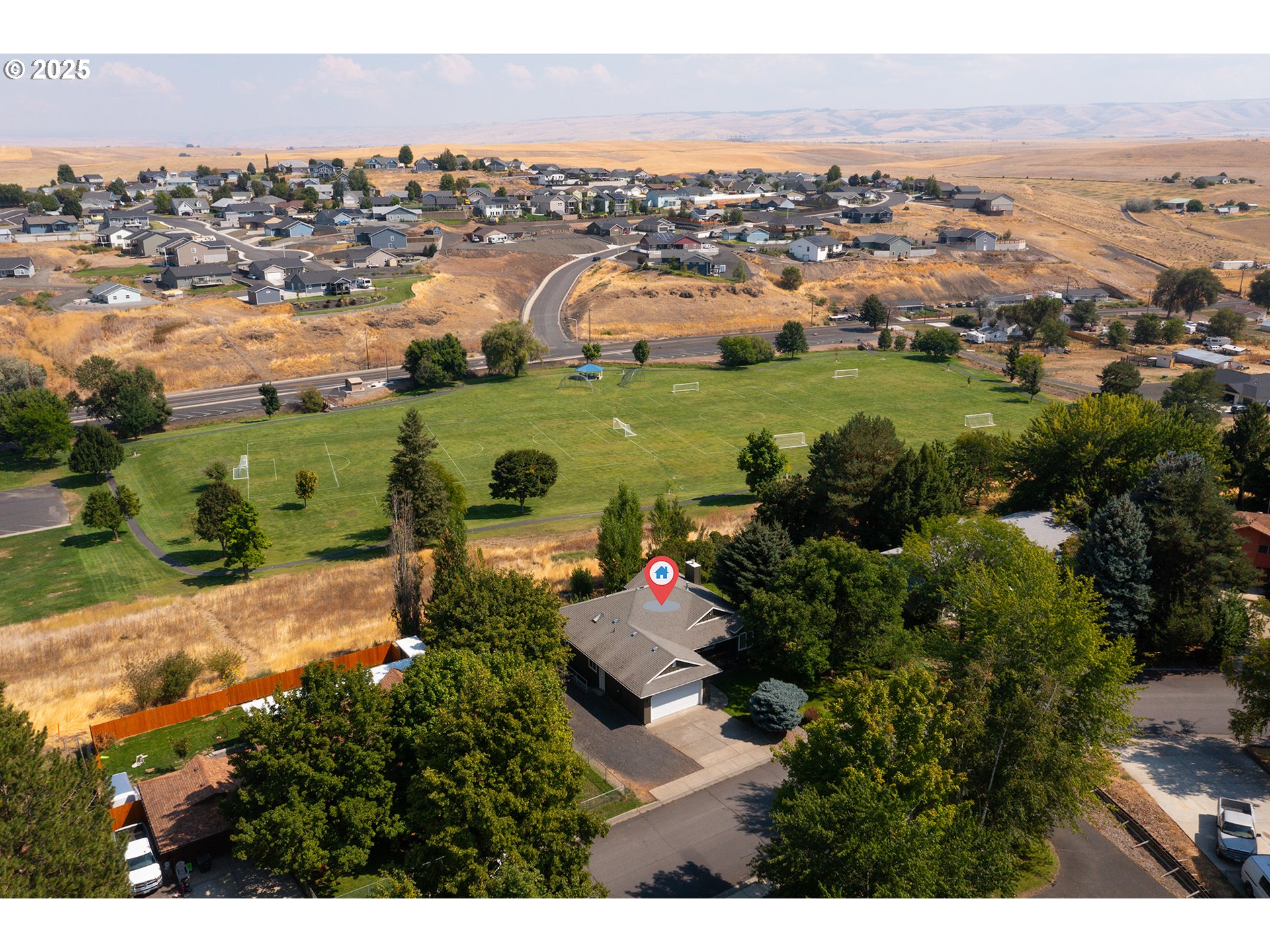 1837 Southwest Athens Avenue Pendleton, OR 97801 - Photo 6 of 42 an aerial view of residential houses with outdoor space and river