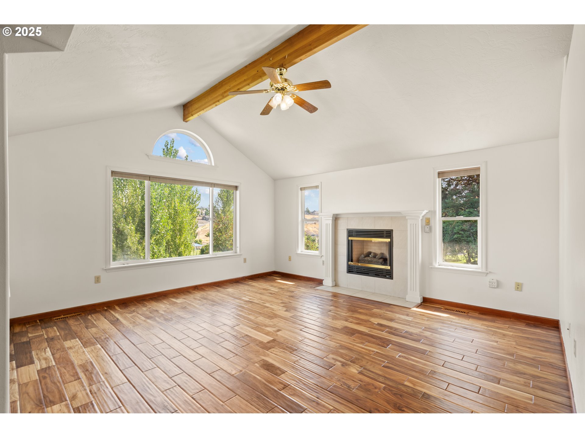 1837 Southwest Athens Avenue Pendleton, OR 97801 - Photo 9 of 42 an empty room with wooden floor fireplace and windows