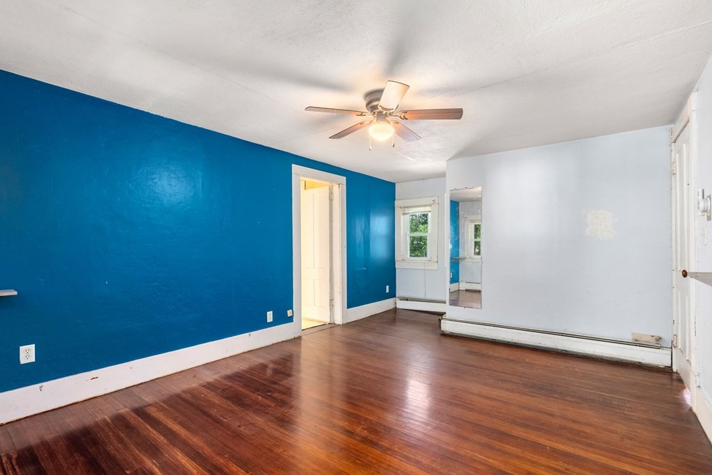 32 Undine Circle Springfield, MA 01109 - Photo 19 of 38 an empty room with wooden floor and windows