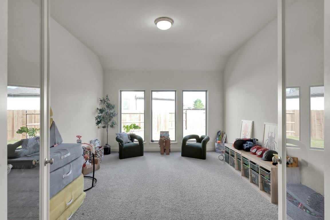 17801 Parnassum Path Conroe, TX 77302 - Photo 18 of 32 Bonus flex room featuring French doors with glass panels, offering a bright and versatile space.