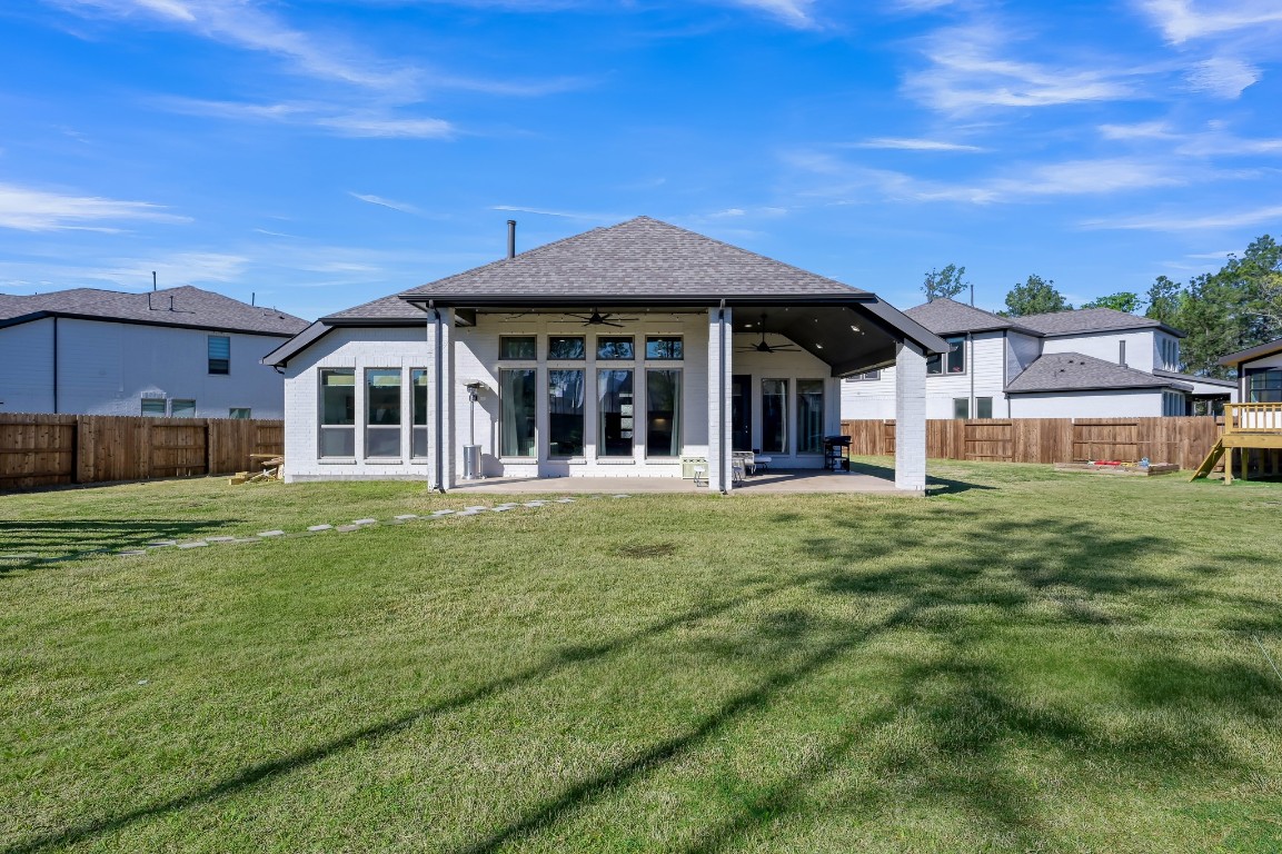 17801 Parnassum Path Conroe, TX 77302 - Photo 27 of 32 Large covered back porch made for relaxing, gathering, and enjoying this amazing outdoor space!