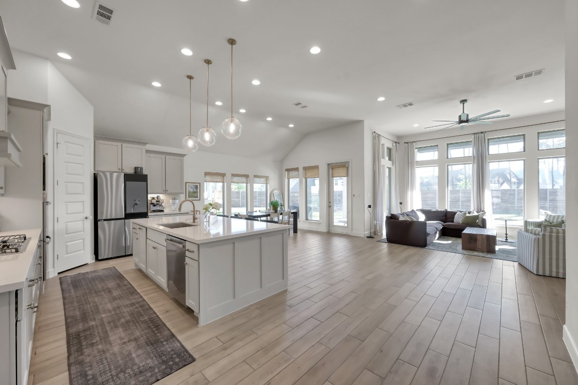 17801 Parnassum Path Conroe, TX 77302 - Photo 4 of 32 An immediate wow—natural light pours through the large windows across the main living areas.