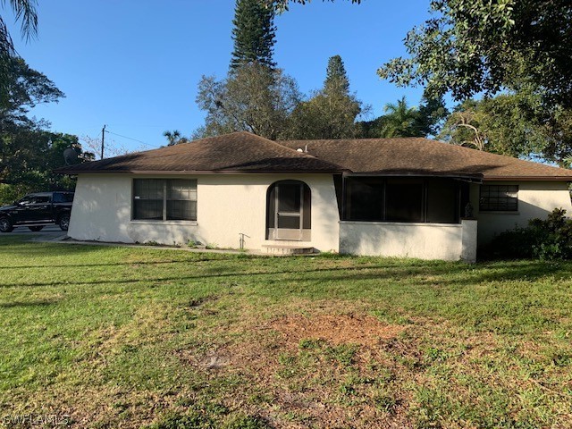 140 Riverview Road Fort Myers, FL 33905 - Photo 1 of 5 a view of a house with a yard