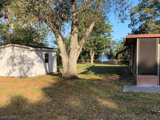 140 Riverview Road Fort Myers, FL 33905 - Photo 3 of 5 a view of a house with backyard and tree