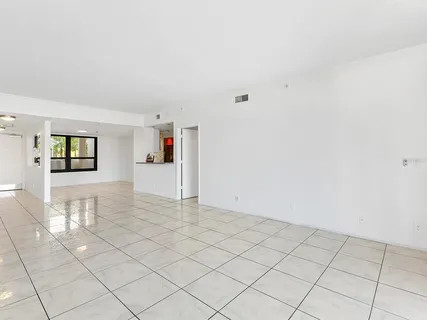 a living room with furniture a flat screen tv and outdoor seating