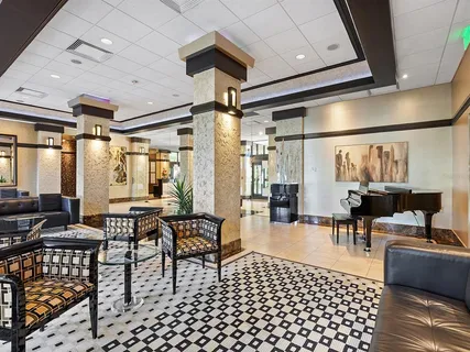 a view of swimming pool with outdoor seating and plants