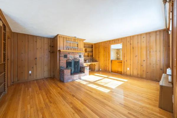 a view of an empty room with glass door