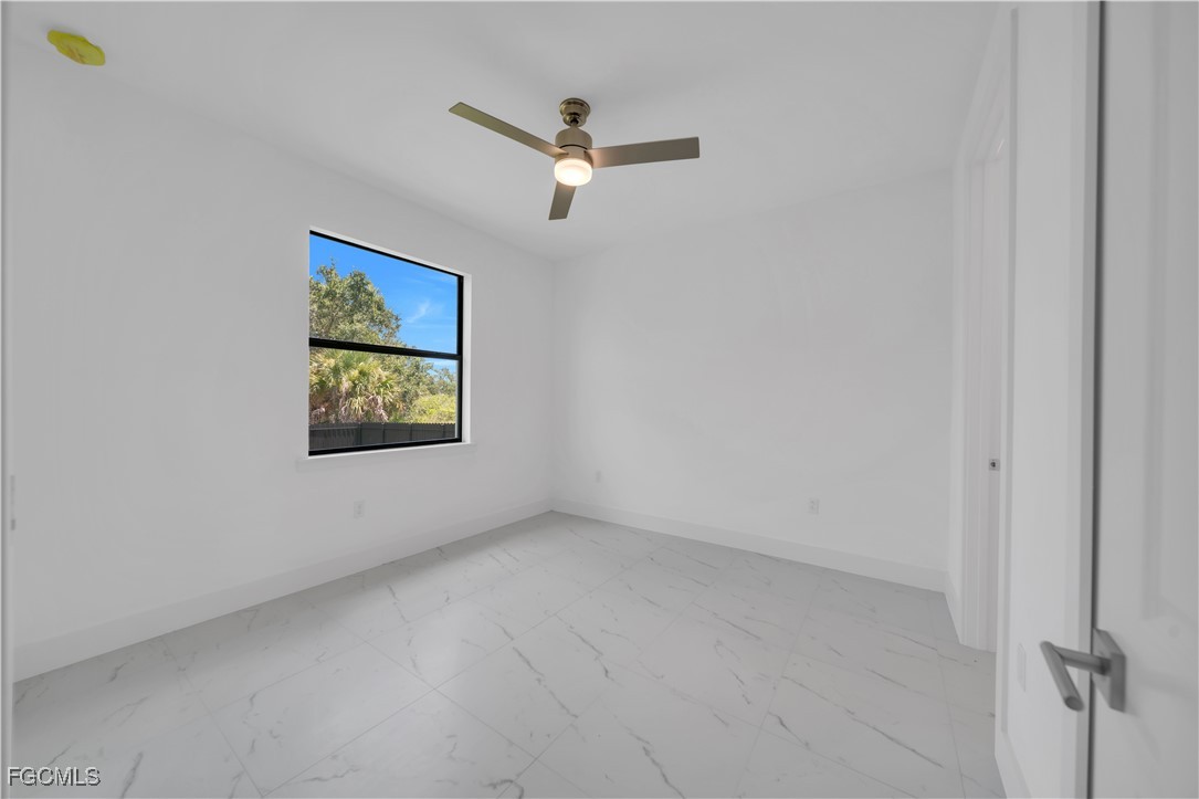 936-938 Homestead Road South Lehigh Acres, FL 33974 - Photo 7 of 9 an empty room with a window
