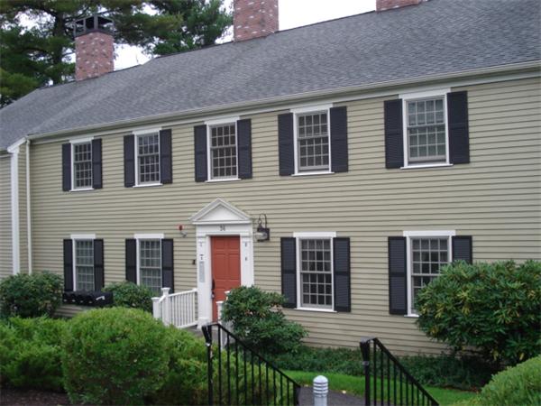 36 Jericho Road, Unit D Weston, MA 02493 - Photo 1 of 1 a front view of house with yard and green space