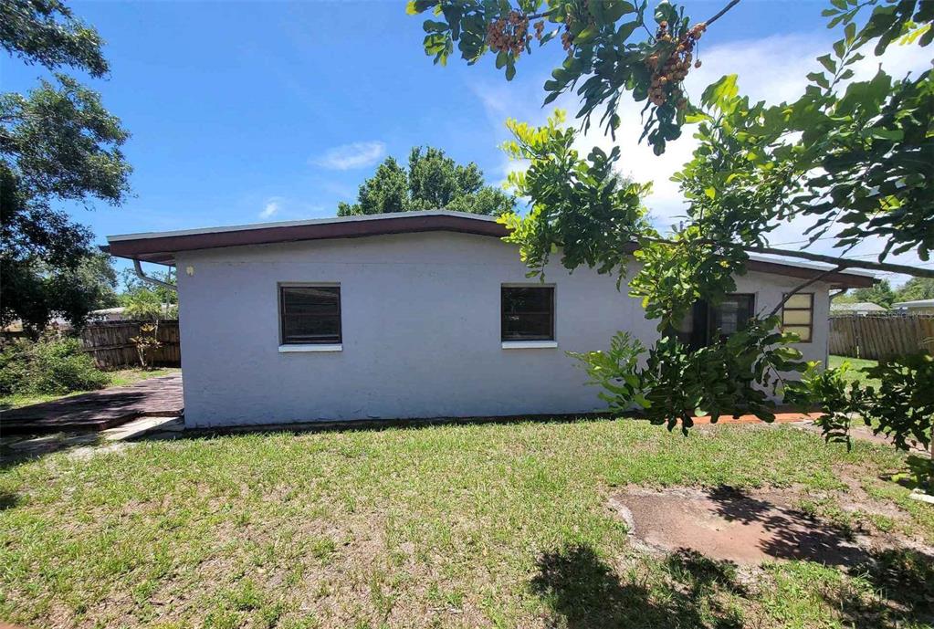 8035 Robin Road Seminole, FL 33777 - Photo 1 of 1 a house with trees in front of it