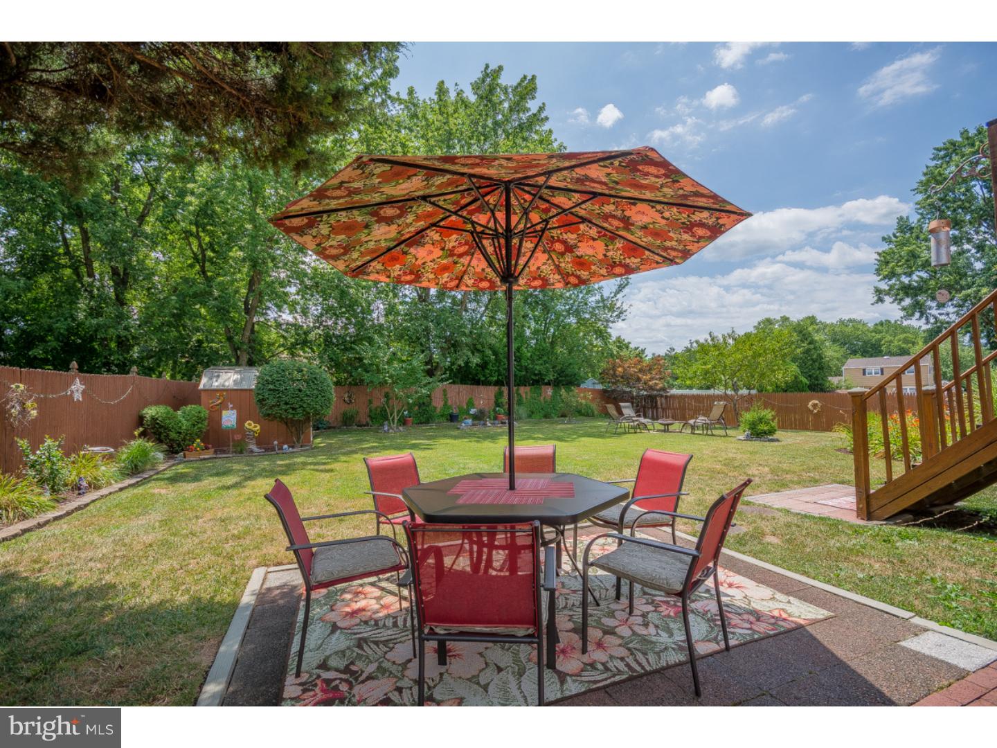 5 Constitution Road Laurel Springs, NJ 08021 - Photo 23 of 25 a patio with a table and chairs