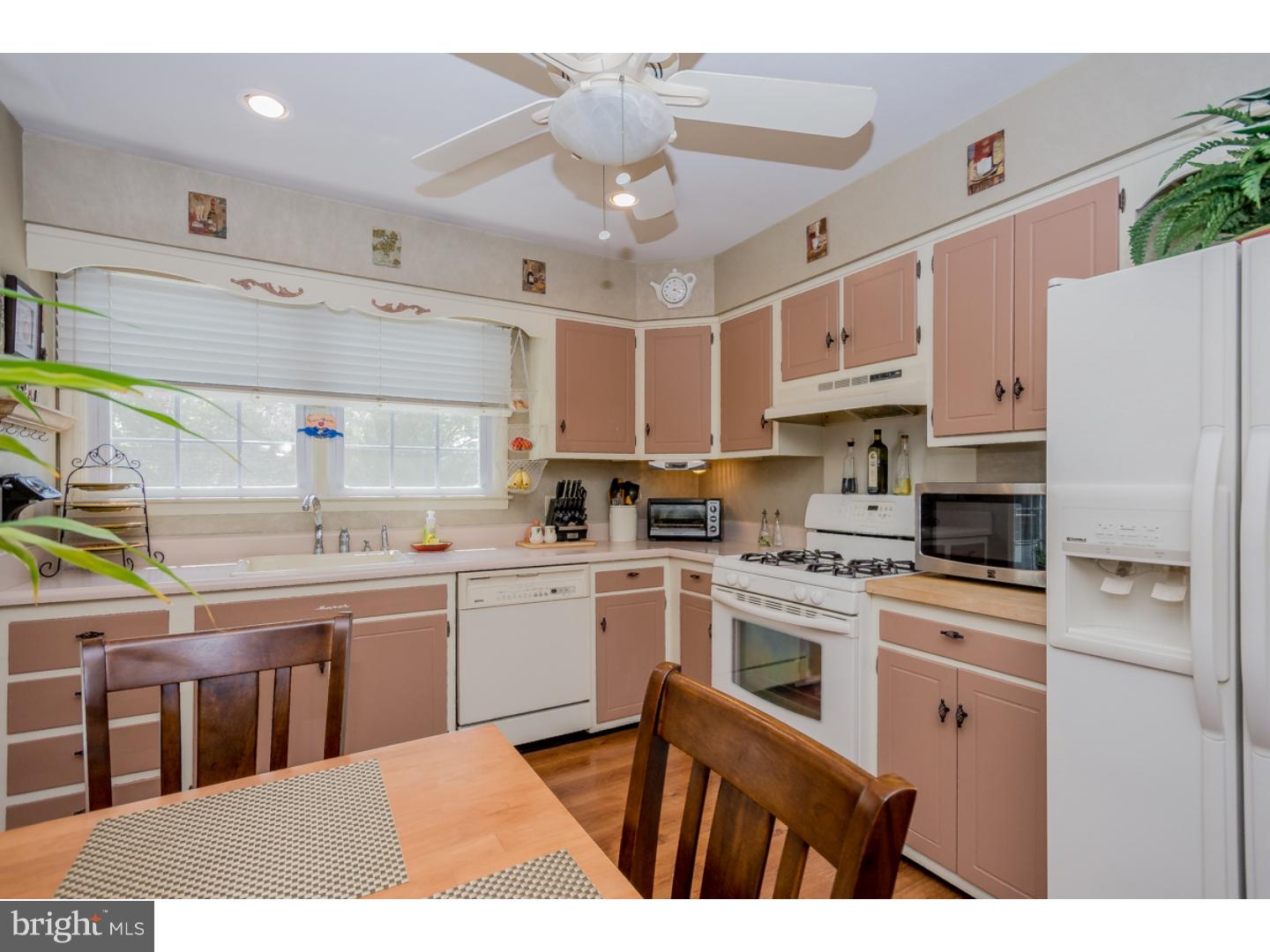 5 Constitution Road Laurel Springs, NJ 08021 - Photo 9 of 25 a kitchen with kitchen island a sink stainless steel appliances and cabinets