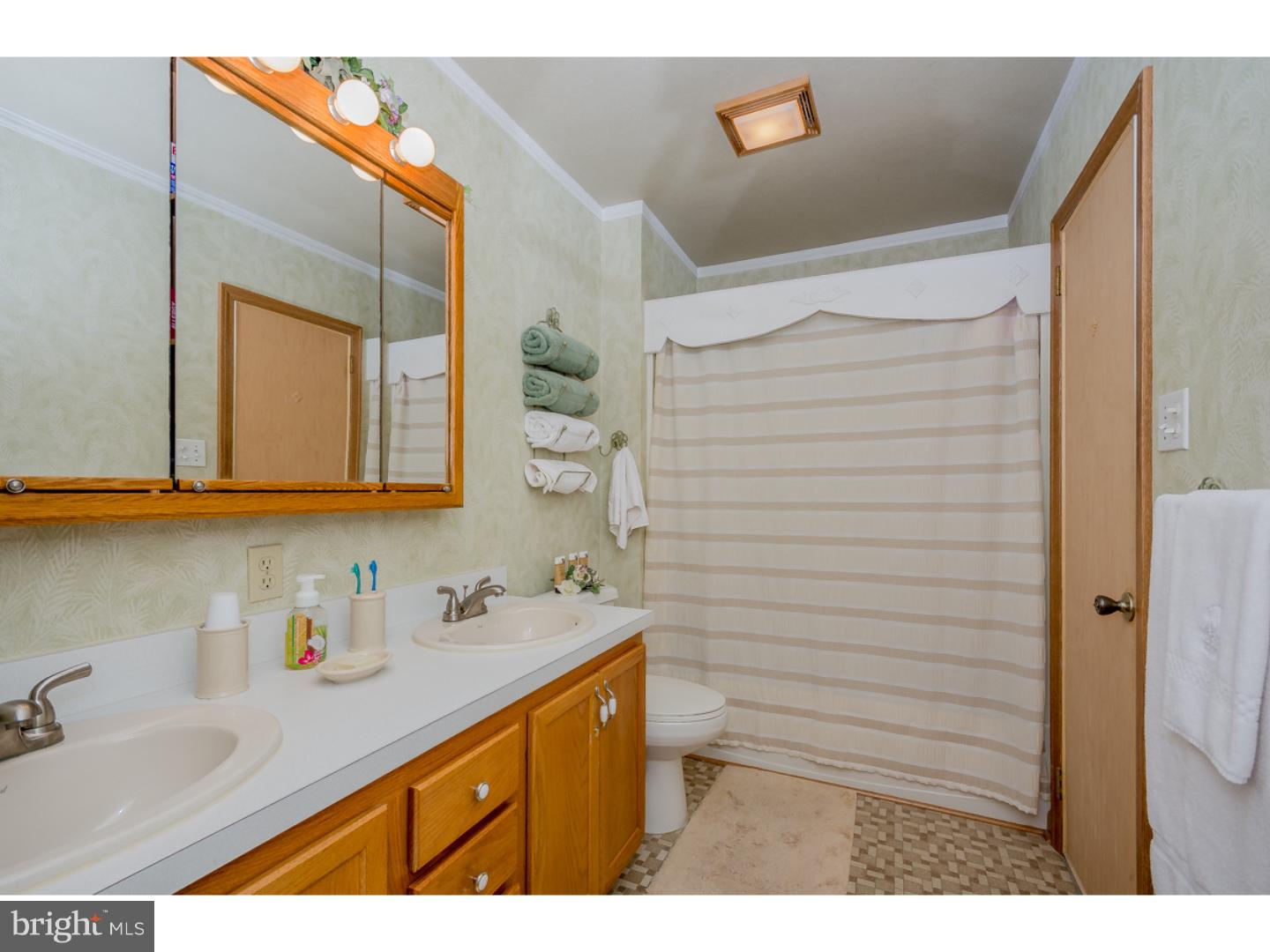 5 Constitution Road Laurel Springs, NJ 08021 - Photo 10 of 25 a bathroom with a sink and a mirror
