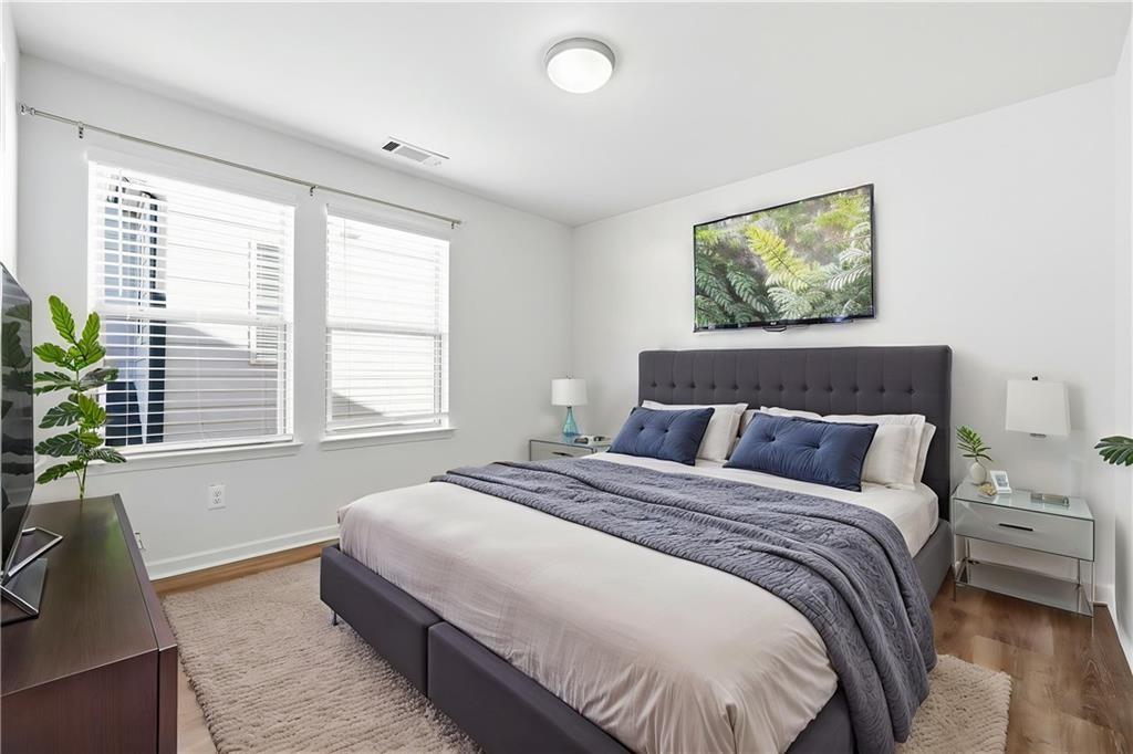 2719 Morgan Spring Trail Buford, GA 30519 - Photo 11 of 46 a bedroom with a bed and a window