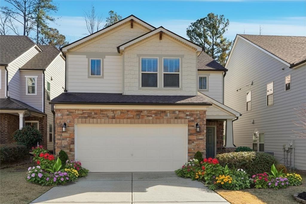 2719 Morgan Spring Trail Buford, GA 30519 - Photo 19 of 46 a front view of a house with a garage