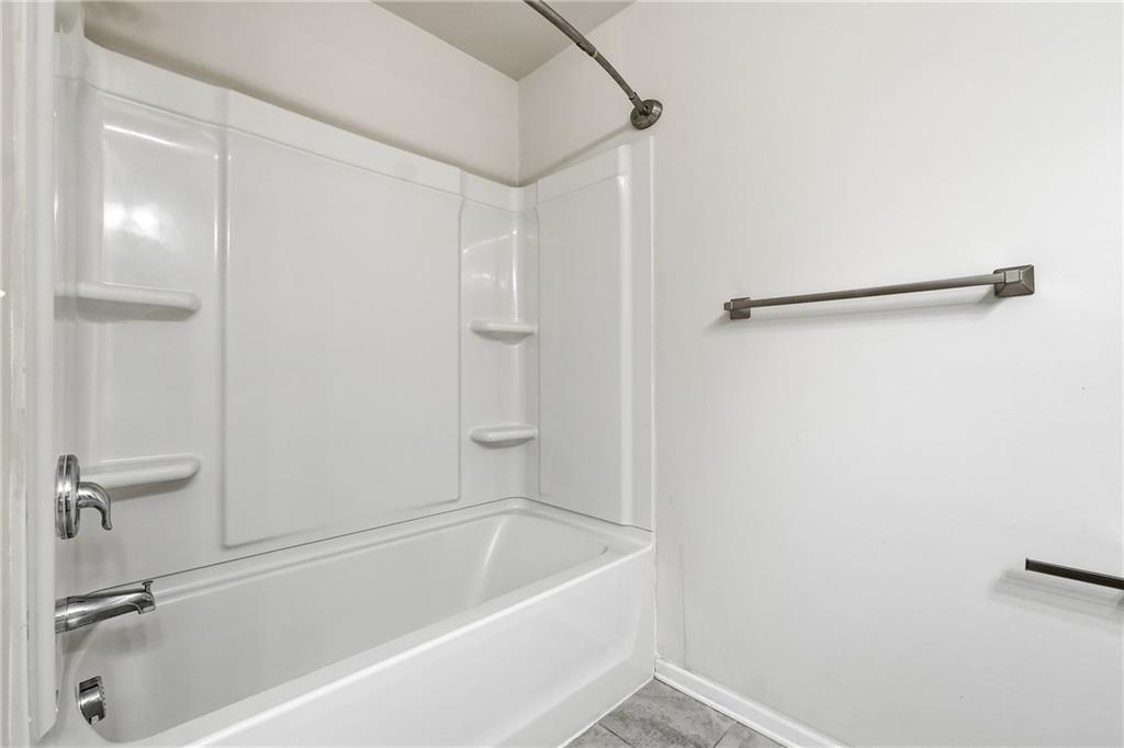 2719 Morgan Spring Trail Buford, GA 30519 - Photo 10 of 46 a bathroom with a tub and a shower