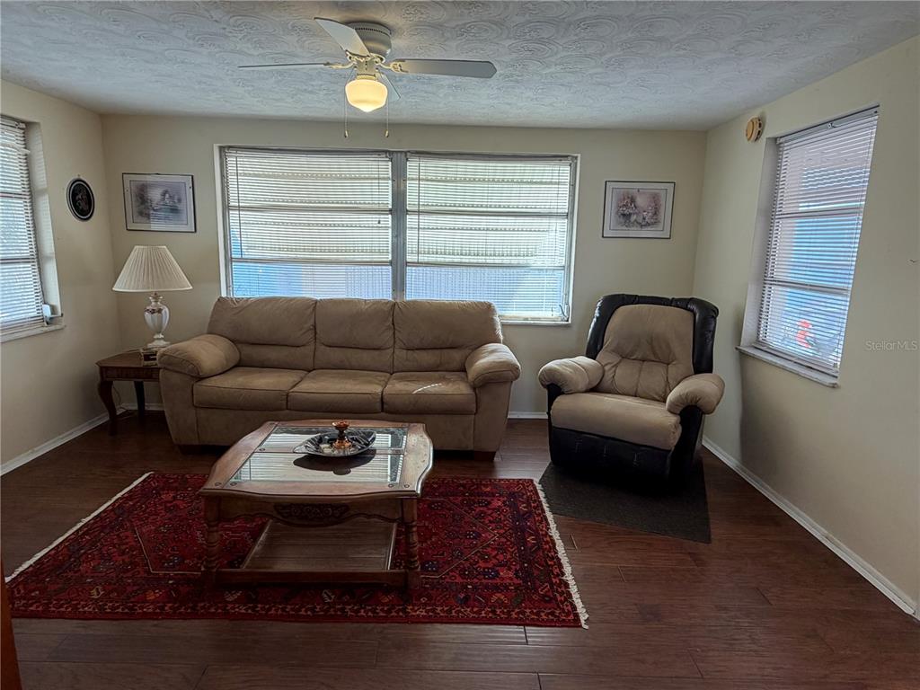 3914 Carioca Road Holiday, FL 34691 - Photo 7 of 23 a living room with furniture a rug and a window