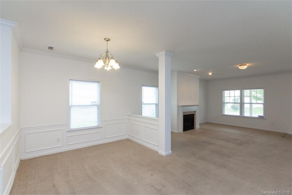 9609 Fernspray Road Charlotte, NC 28213 - Photo 11 of 30 an empty room with windows and fireplace