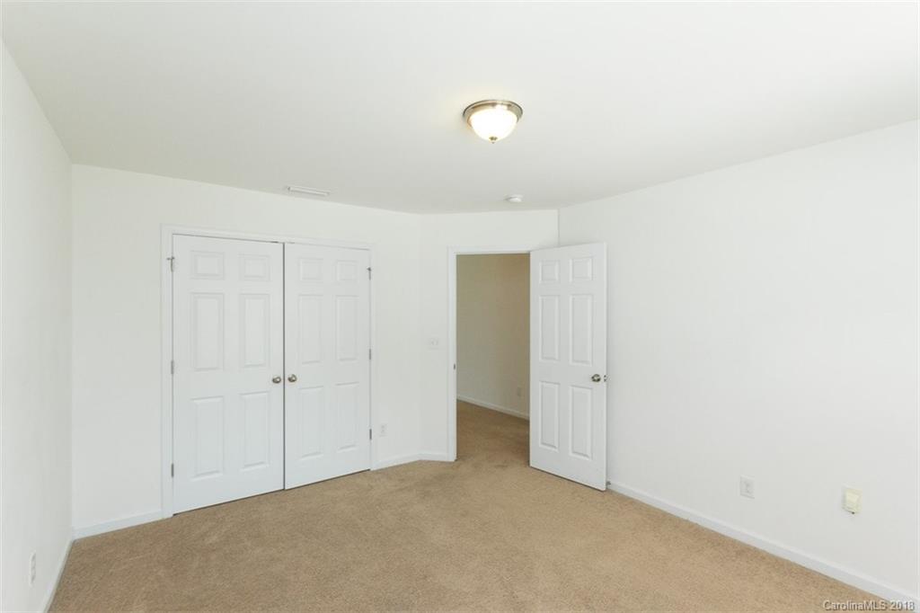 9609 Fernspray Road Charlotte, NC 28213 - Photo 22 of 30 an empty room with closet area