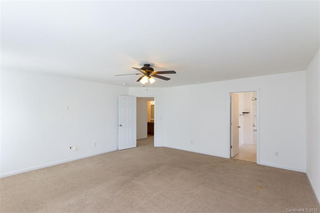 9609 Fernspray Road Charlotte, NC 28213 - Photo 24 of 30 a view of a chandelier fan in a room