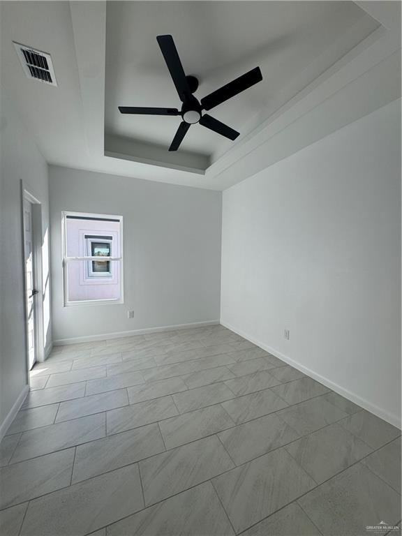 104 Sunflower Street, Unit 1 Mission, TX 78572 - Photo 14 of 21 a view of a livingroom with a ceiling fan and window