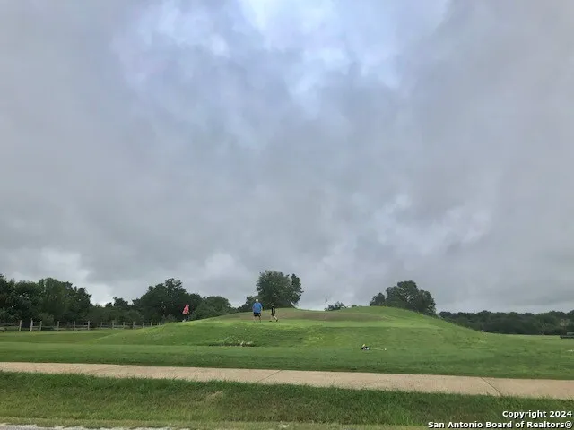 a view of a park with welcome board