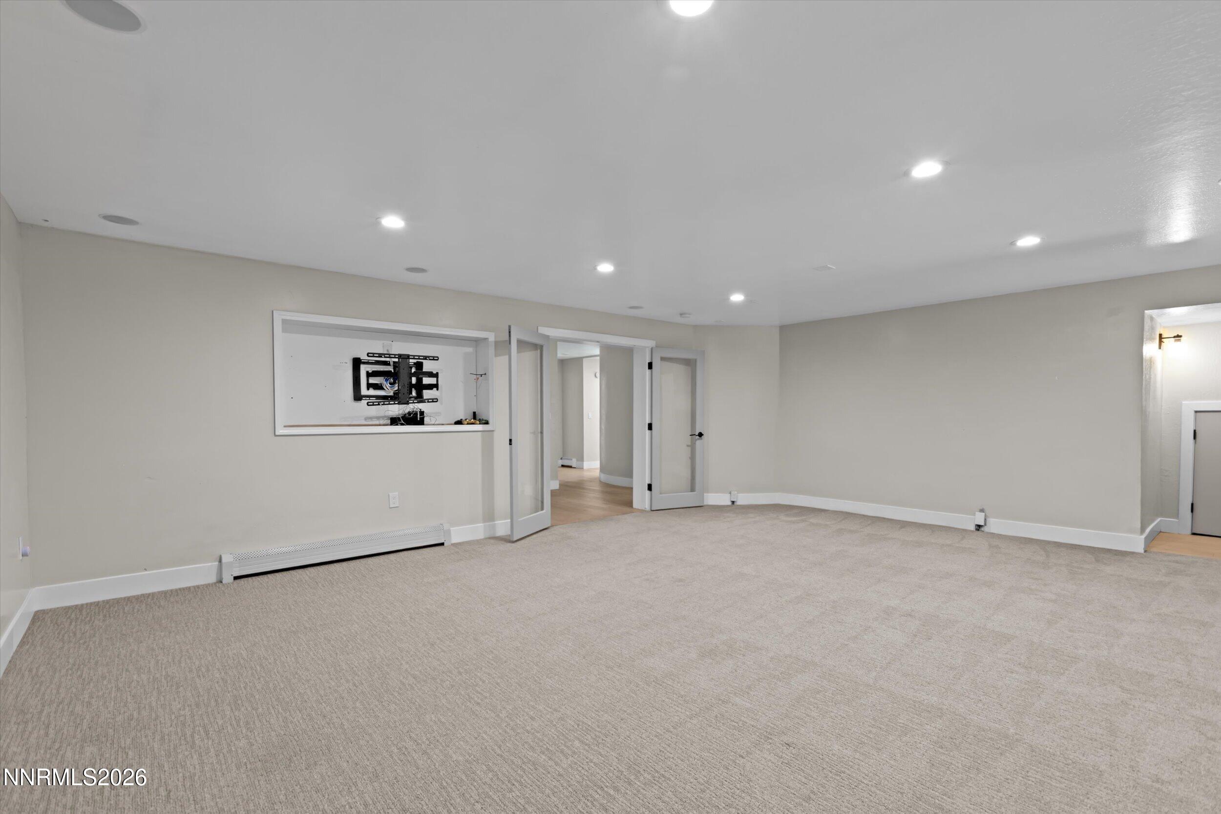 2725 West Lake Ridge Shores Reno, NV 89519 - Photo 34 of 49 an empty room with white wall and windows
