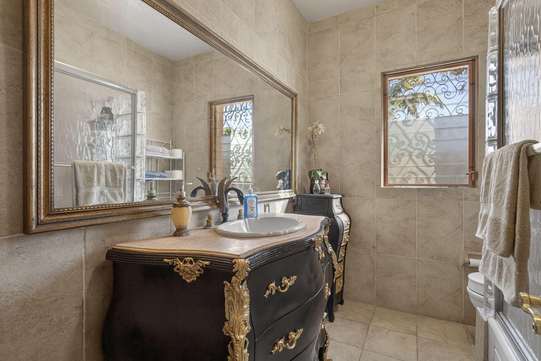 445 29th Street West Palm Beach, FL 33407 - Photo 12 of 61 a bathroom with a sink a vanity and a mirror