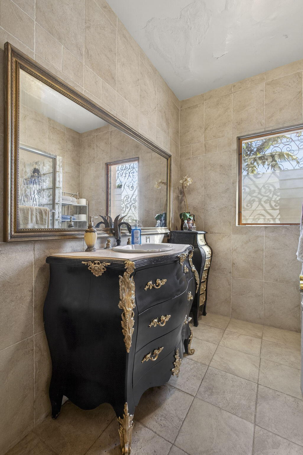 445 29th Street West Palm Beach, FL 33407 - Photo 13 of 61 a bathroom with a sink a vanity and a mirror