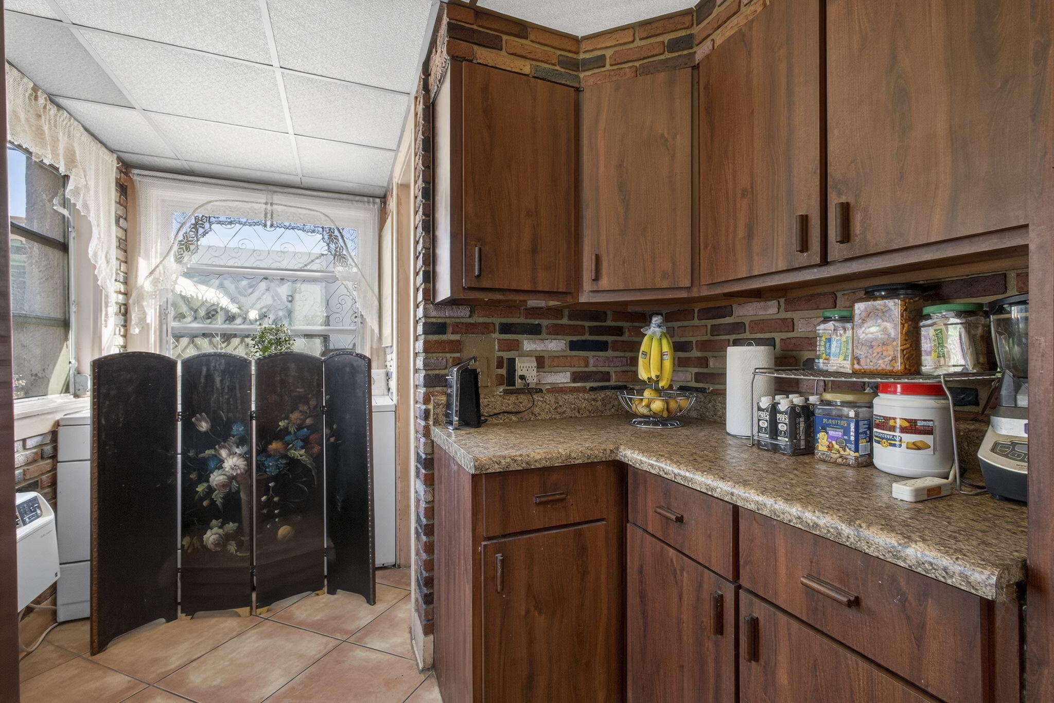 445 29th Street West Palm Beach, FL 33407 - Photo 18 of 61 a kitchen with stainless steel appliances granite countertop a refrigerator and a sink