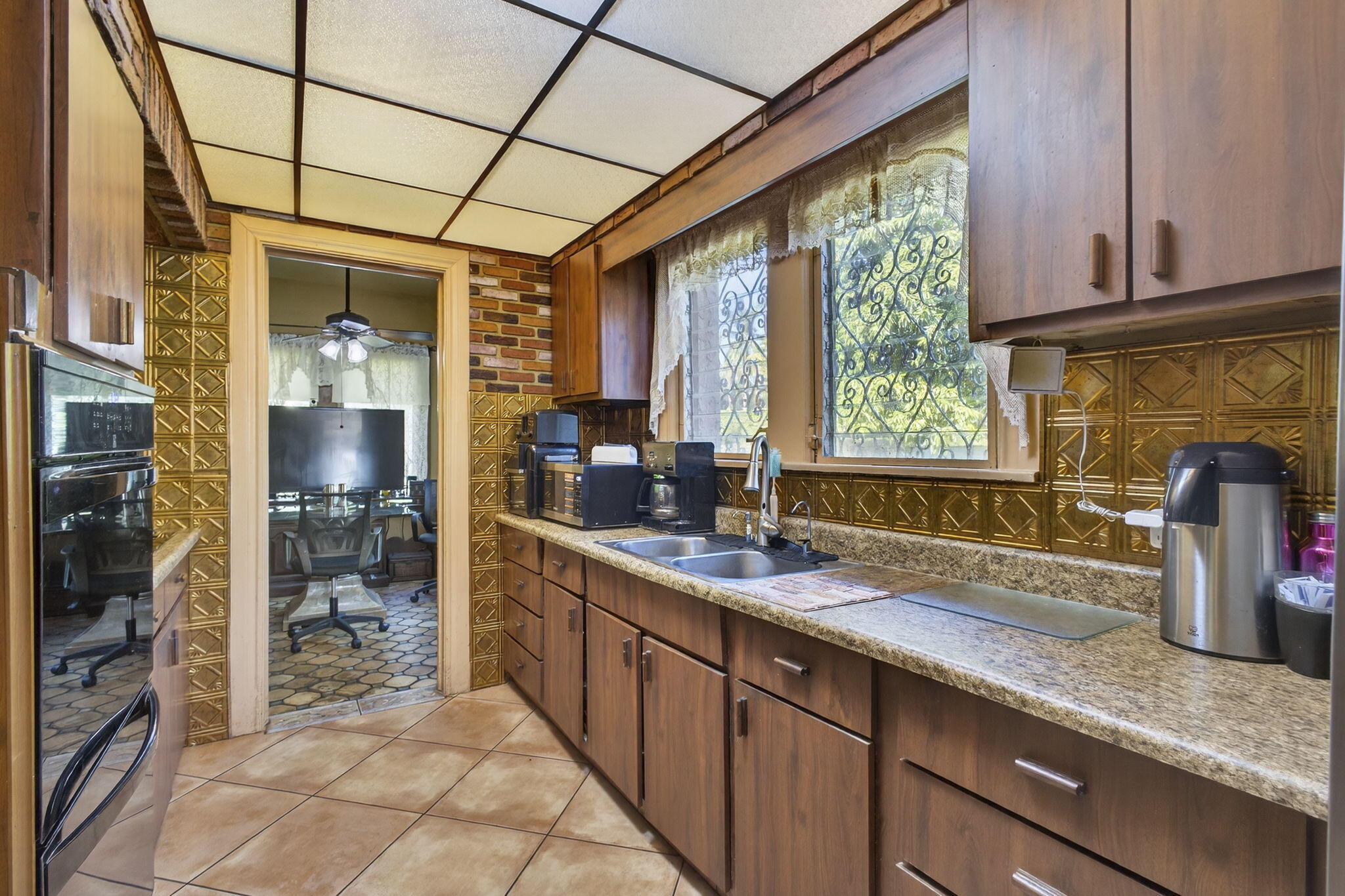445 29th Street West Palm Beach, FL 33407 - Photo 20 of 61 a kitchen with stainless steel appliances granite countertop a sink and cabinets
