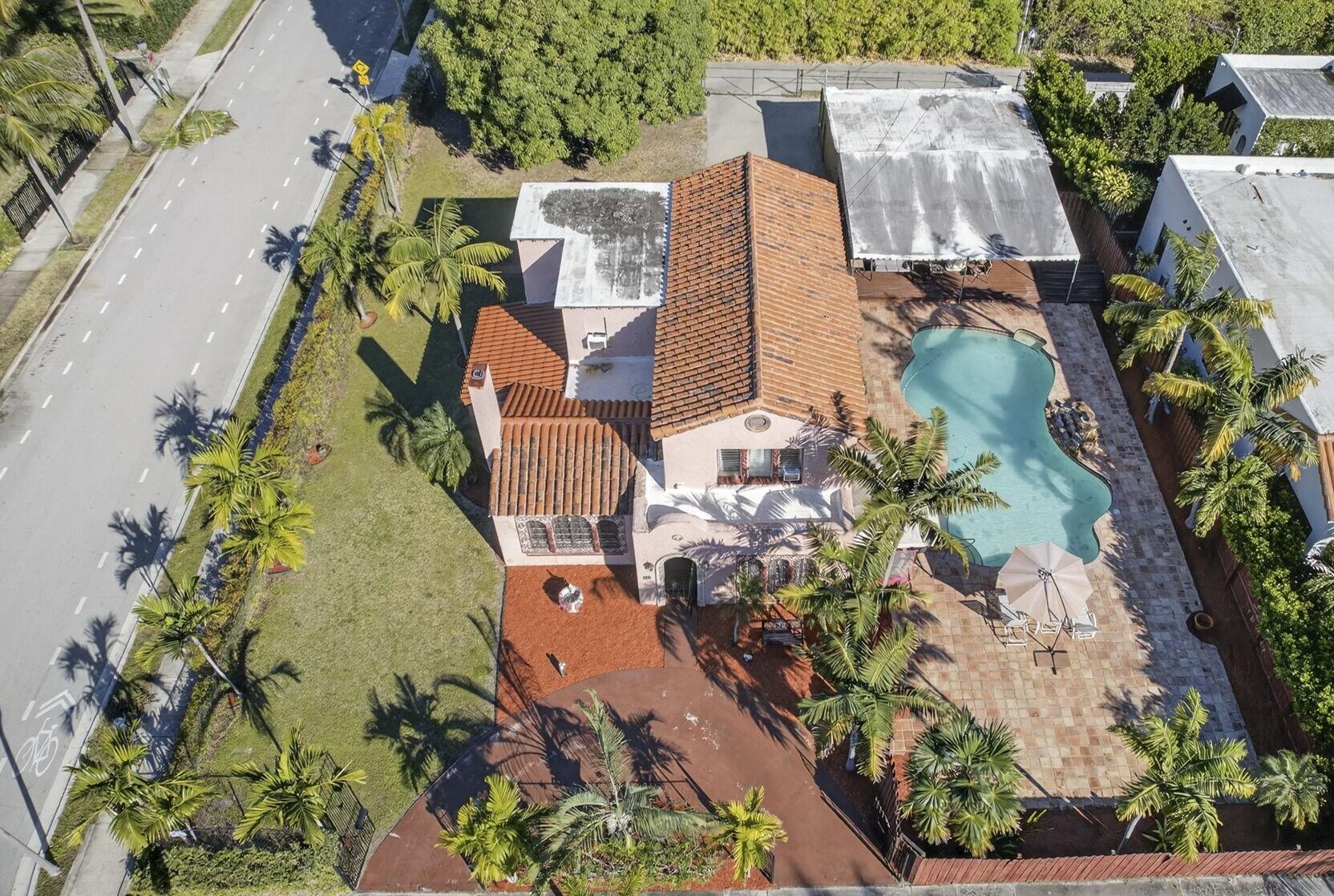 445 29th Street West Palm Beach, FL 33407 - Photo 2 of 61 an aerial view of a house with a yard and garden