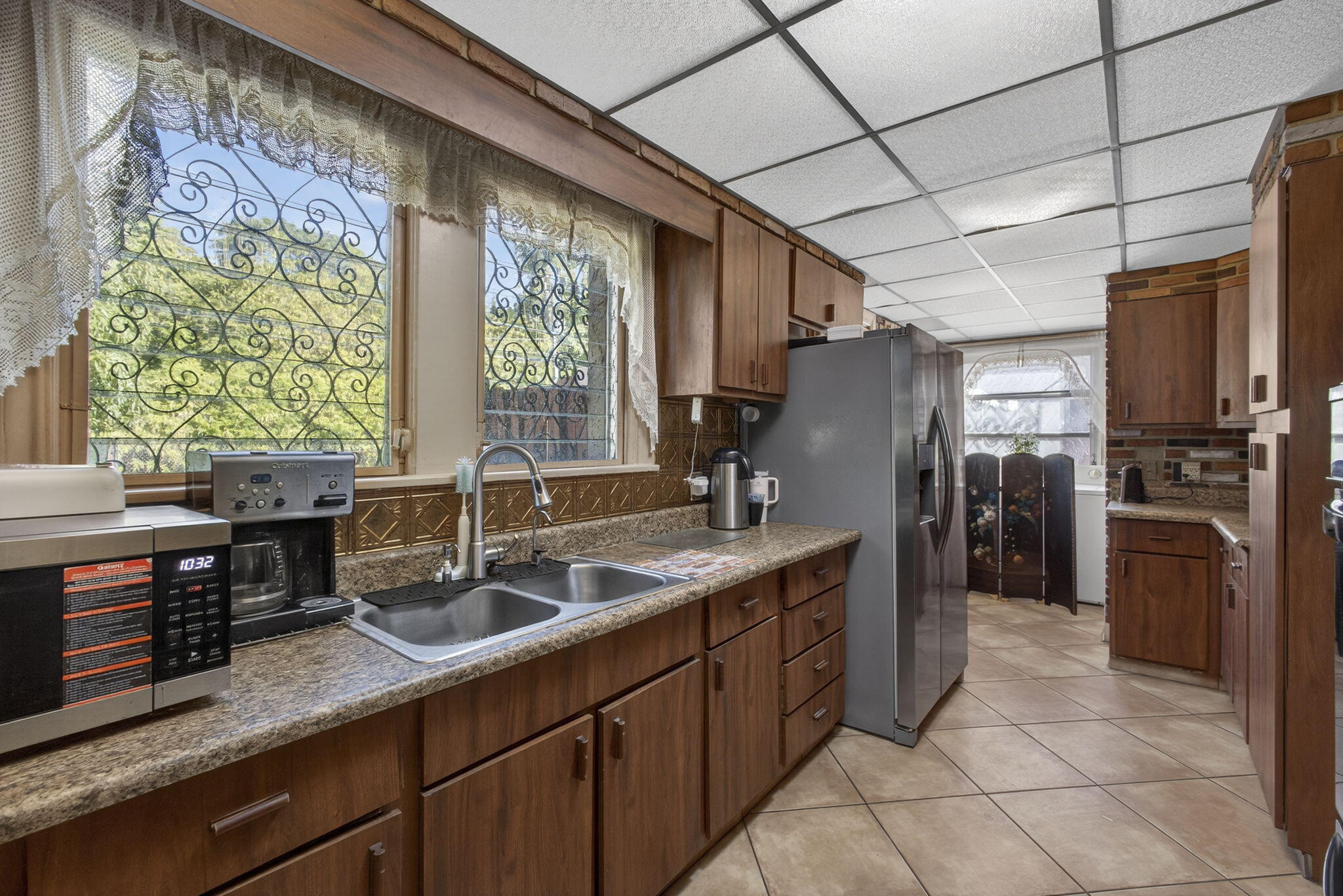 445 29th Street West Palm Beach, FL 33407 - Photo 21 of 61 a kitchen with stainless steel appliances granite countertop a sink stove and refrigerator