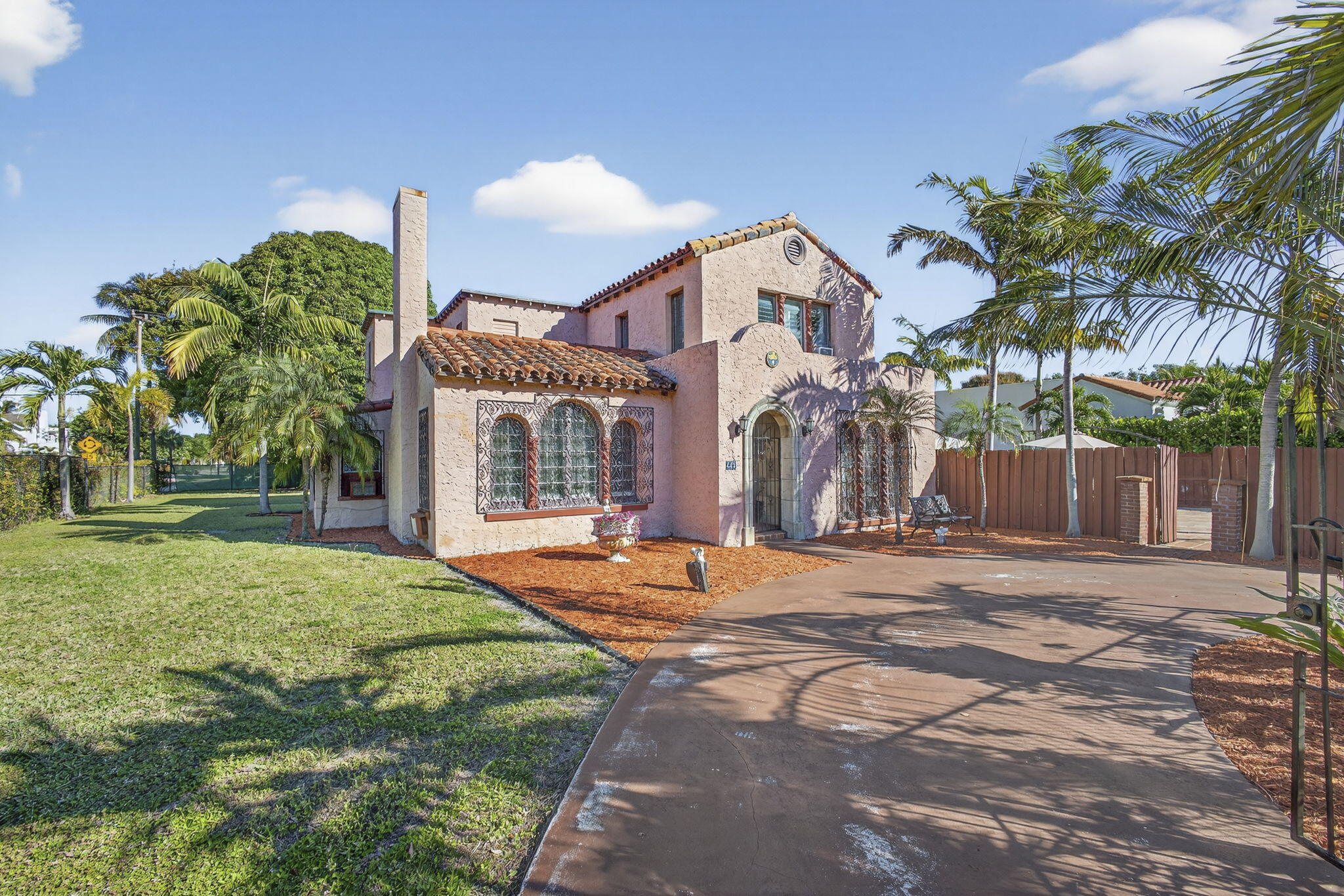 445 29th Street West Palm Beach, FL 33407 - Photo 3 of 61 a front view of a house with a yard and potted plants