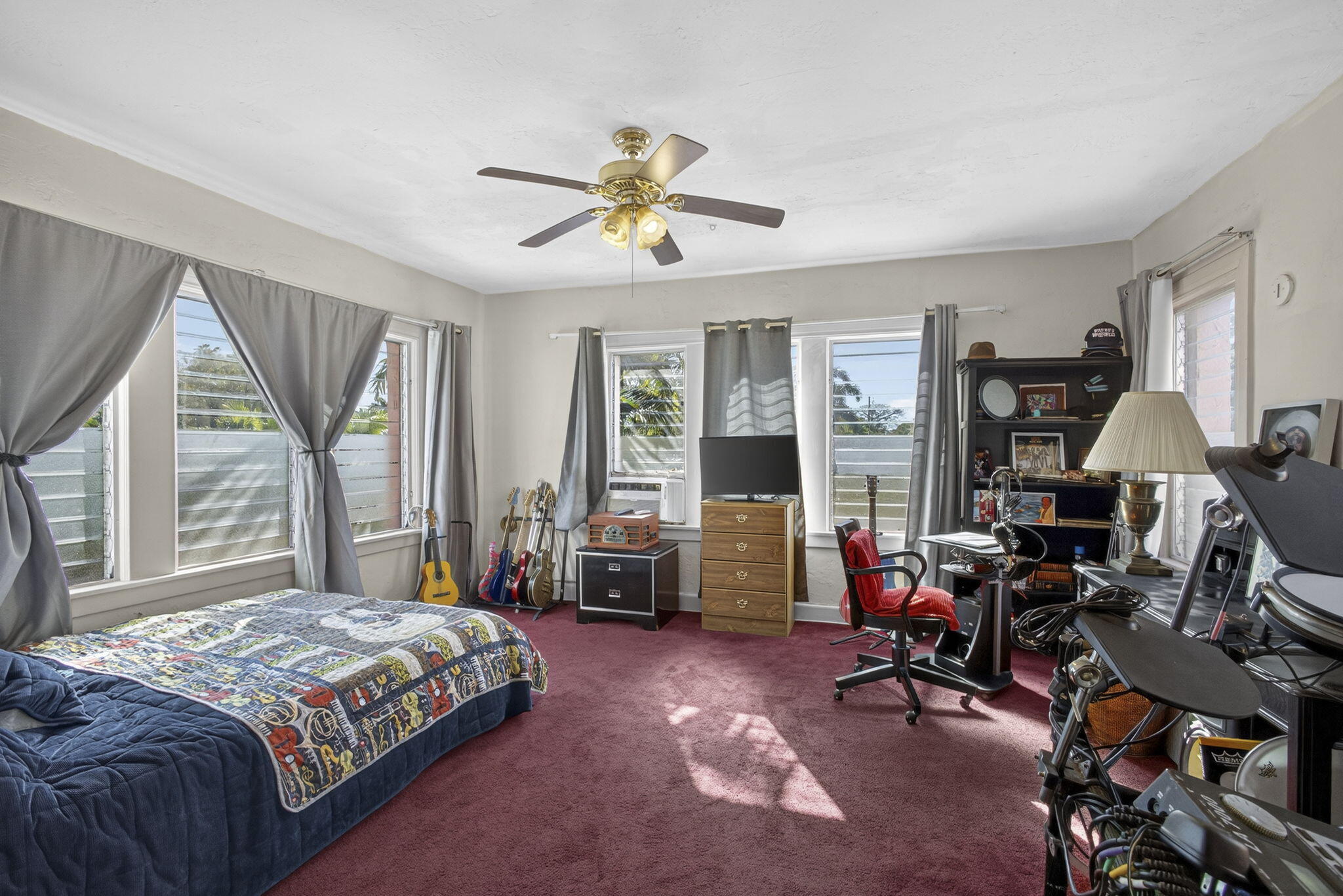 445 29th Street West Palm Beach, FL 33407 - Photo 33 of 61 a bedroom with a bed gym equipment and a large window