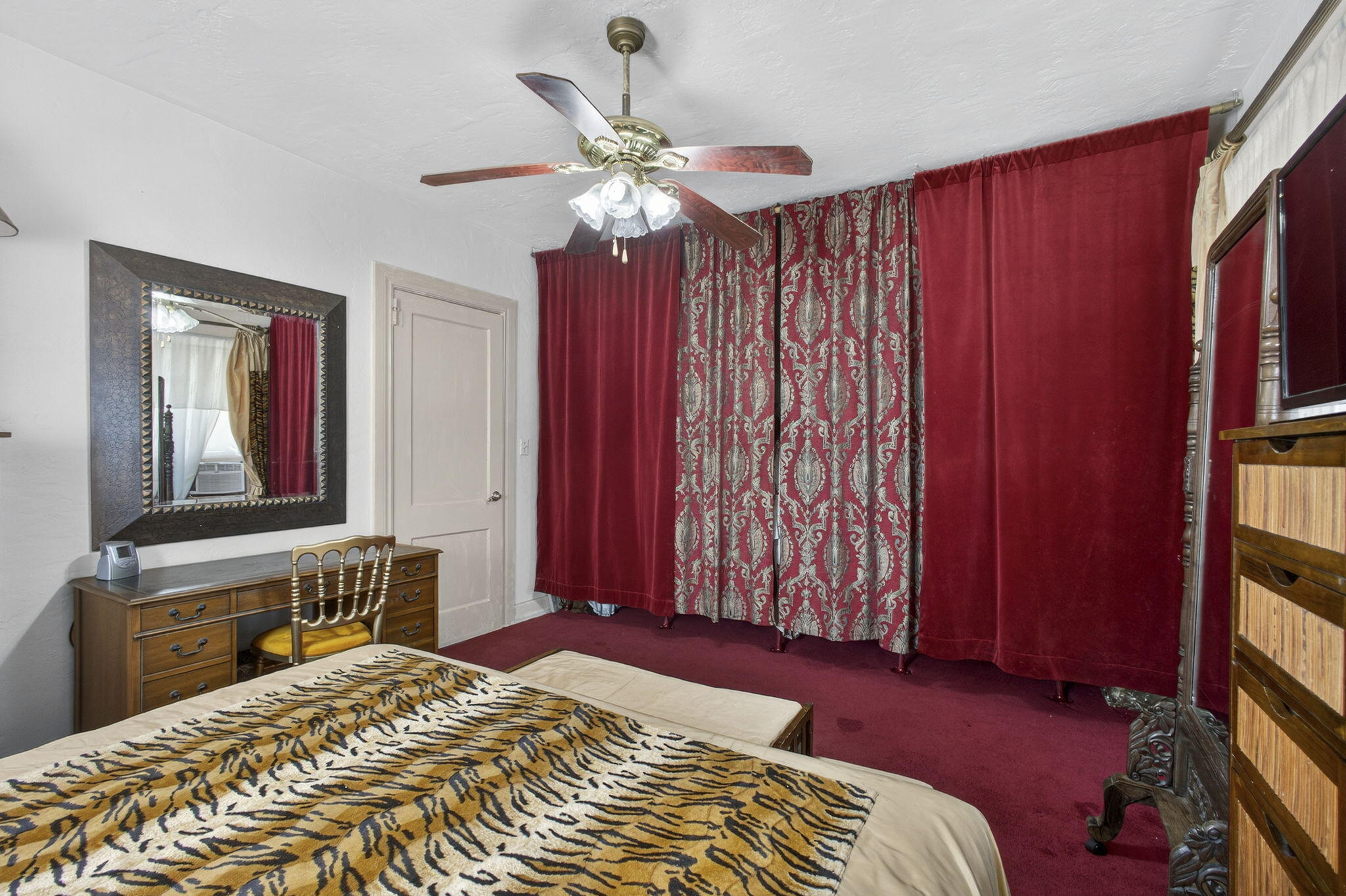 445 29th Street West Palm Beach, FL 33407 - Photo 37 of 61 a bedroom with a bed and a chandelier