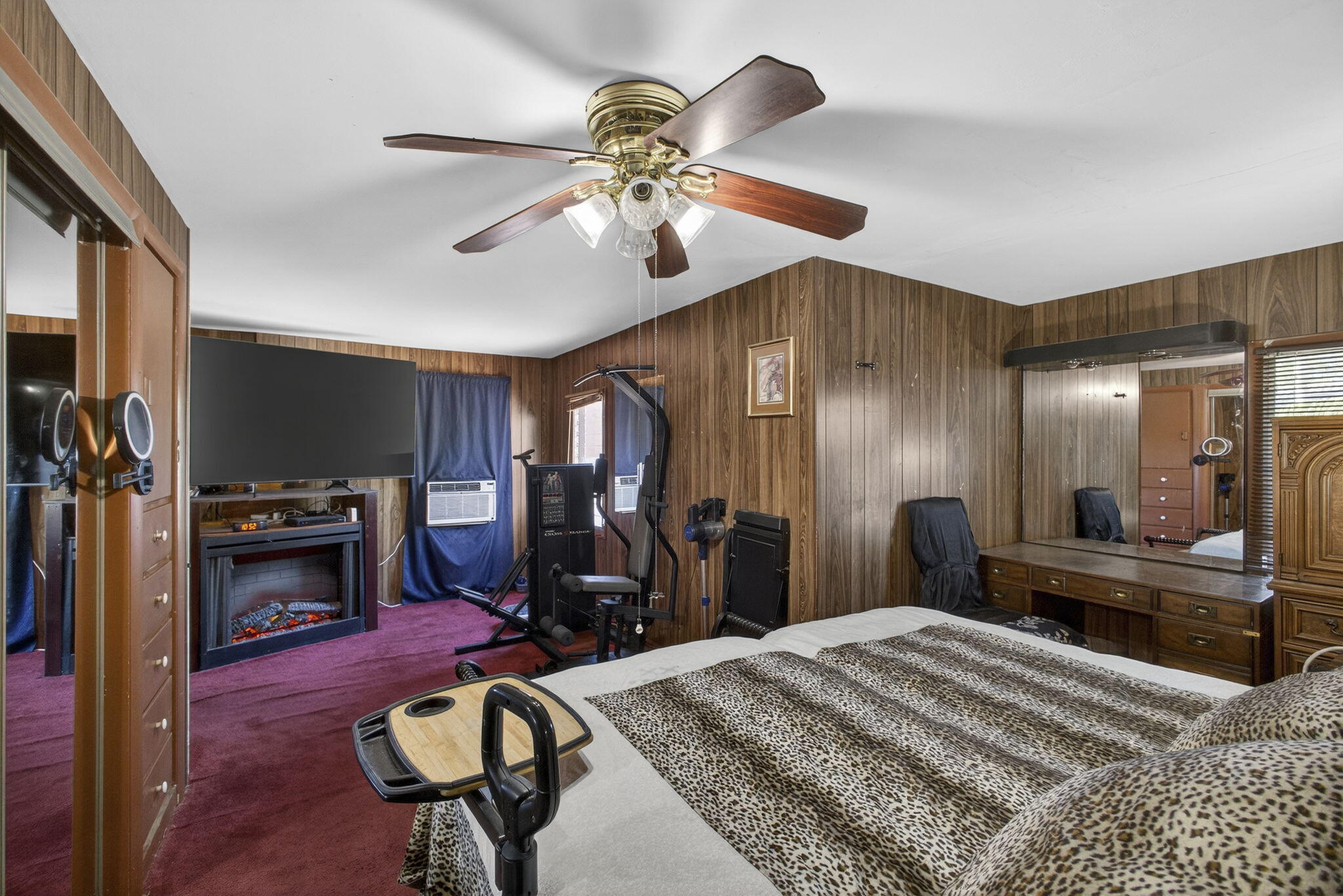 445 29th Street West Palm Beach, FL 33407 - Photo 40 of 61 a bed room with a bed mirror and a chandelier