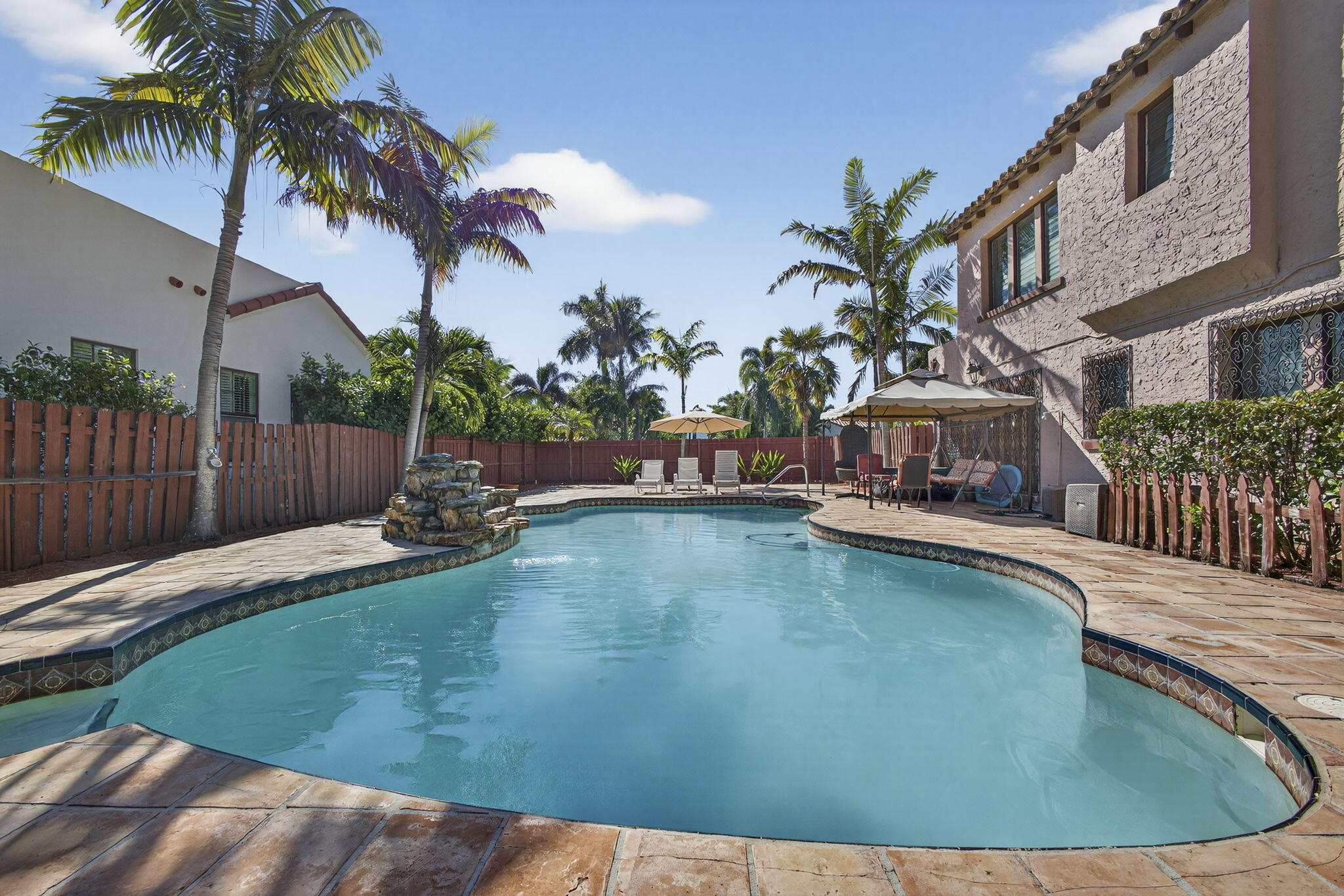 445 29th Street West Palm Beach, FL 33407 - Photo 43 of 61 a swimming pool with outdoor seating and yard