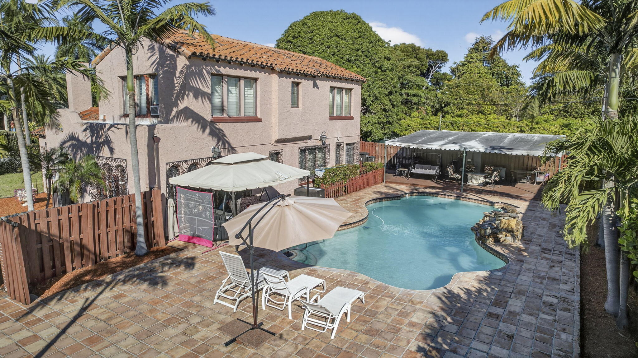 445 29th Street West Palm Beach, FL 33407 - Photo 47 of 61 a view of a patio with chair and tables