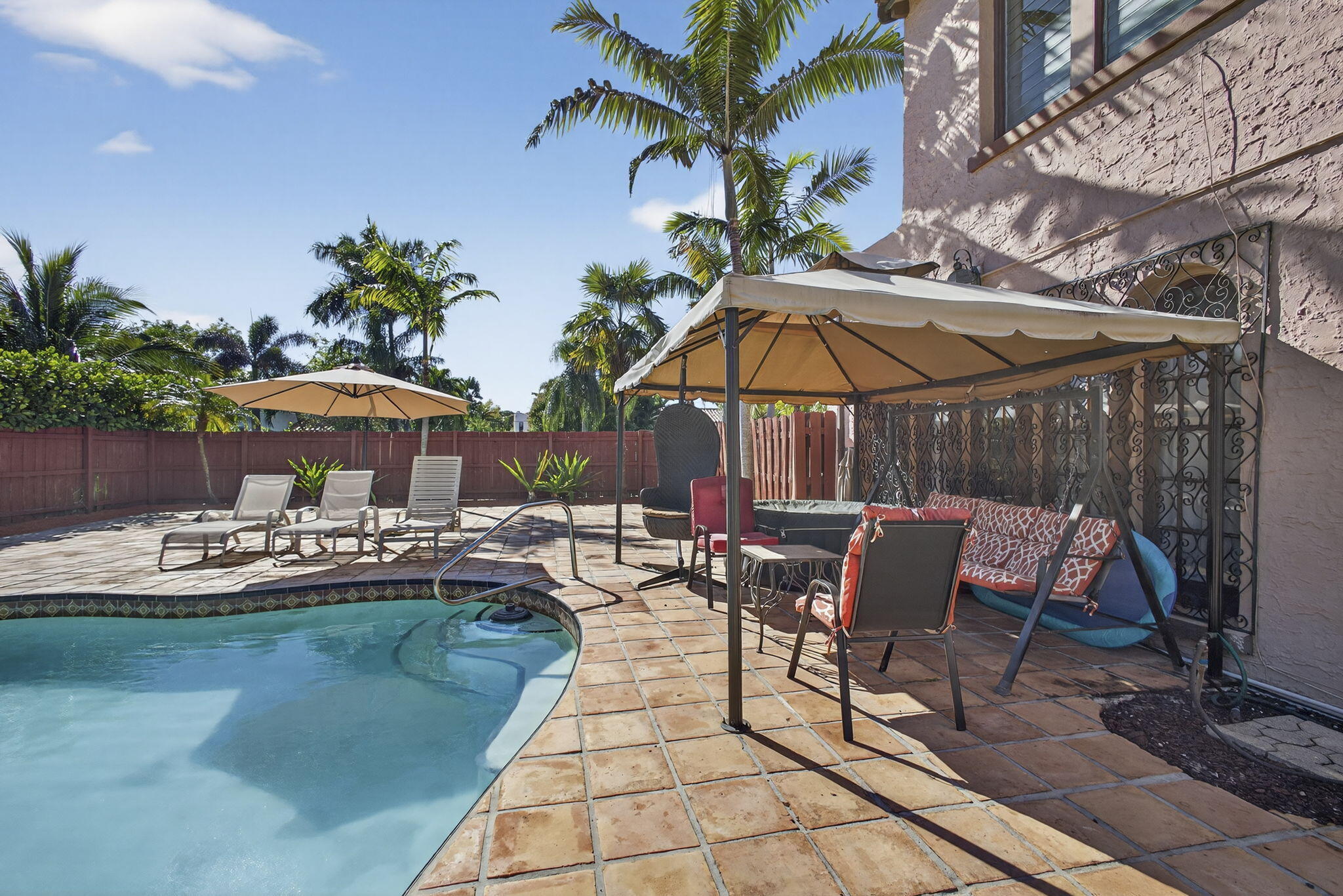 445 29th Street West Palm Beach, FL 33407 - Photo 49 of 61 a view of a swimming pool with lounge chairs