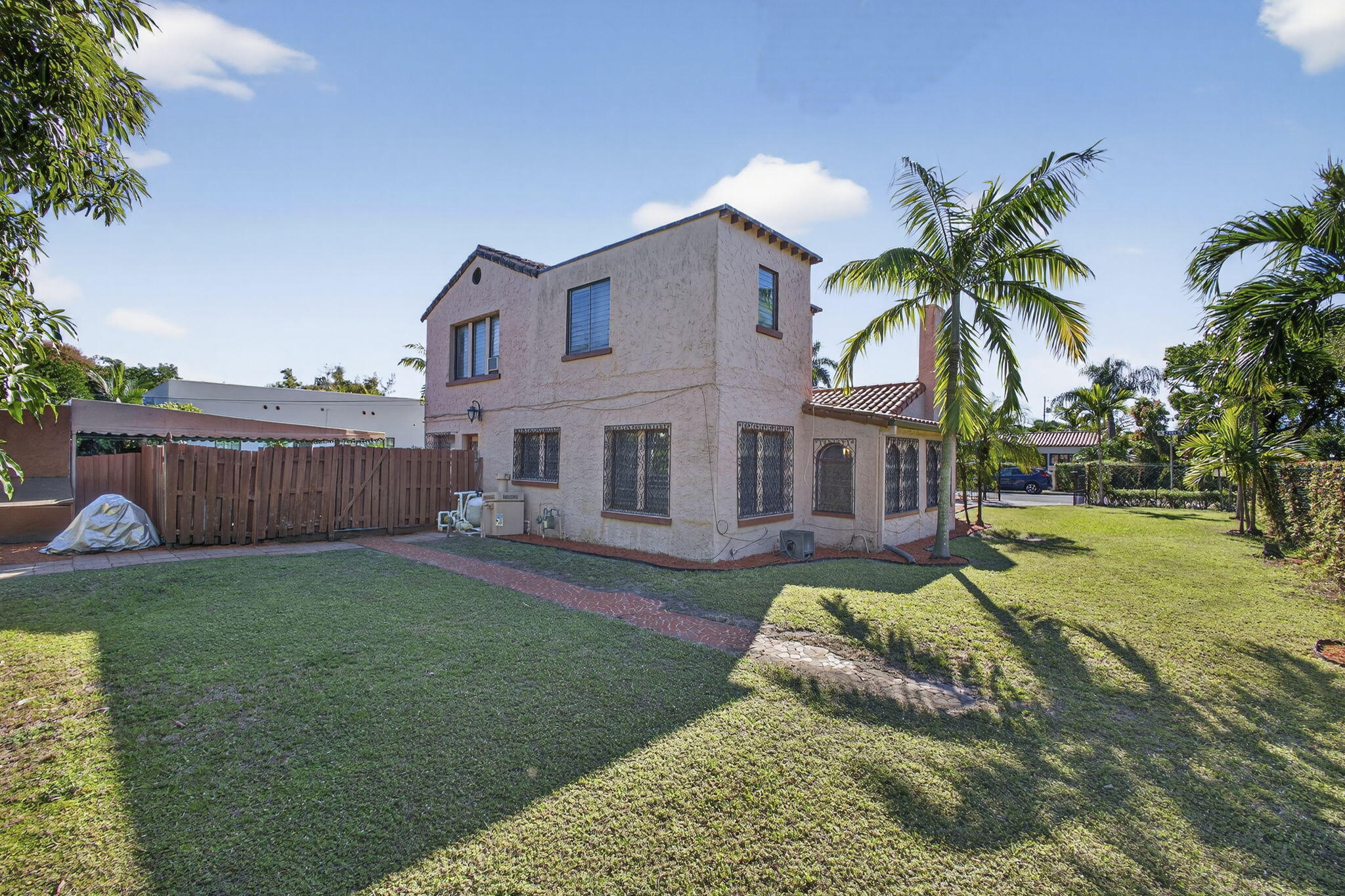 445 29th Street West Palm Beach, FL 33407 - Photo 51 of 61 a view of a house with a yard and sitting area