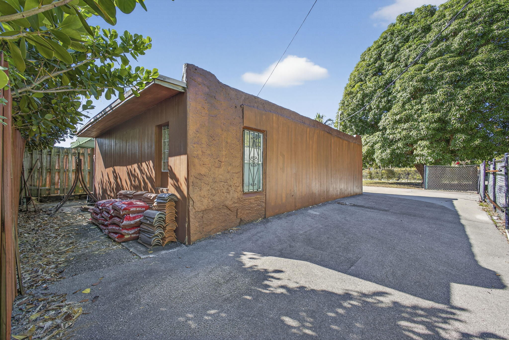 445 29th Street West Palm Beach, FL 33407 - Photo 55 of 61 a front view of a house with a yard