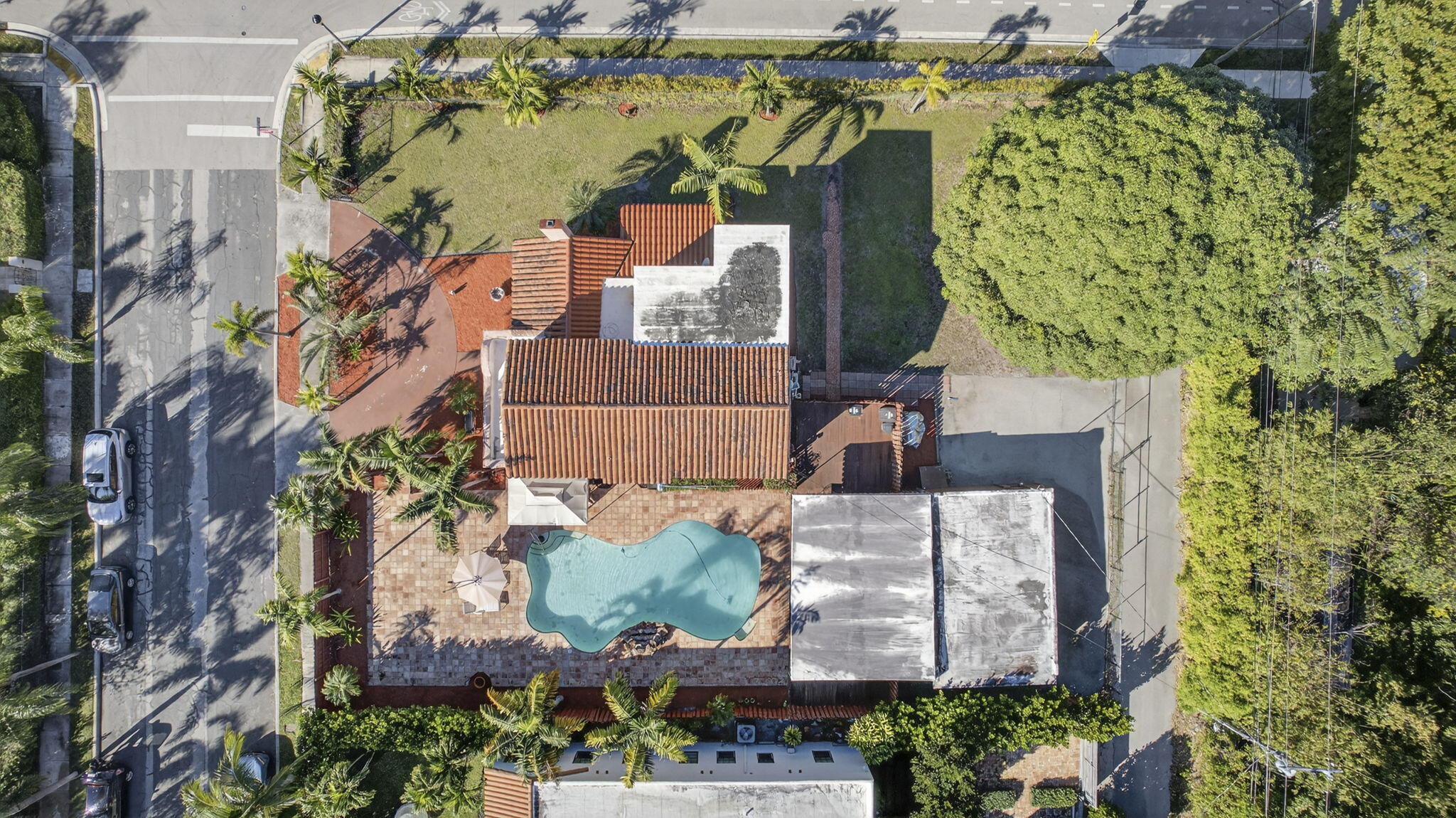 445 29th Street West Palm Beach, FL 33407 - Photo 57 of 61 an aerial view of a house with a yard and large trees