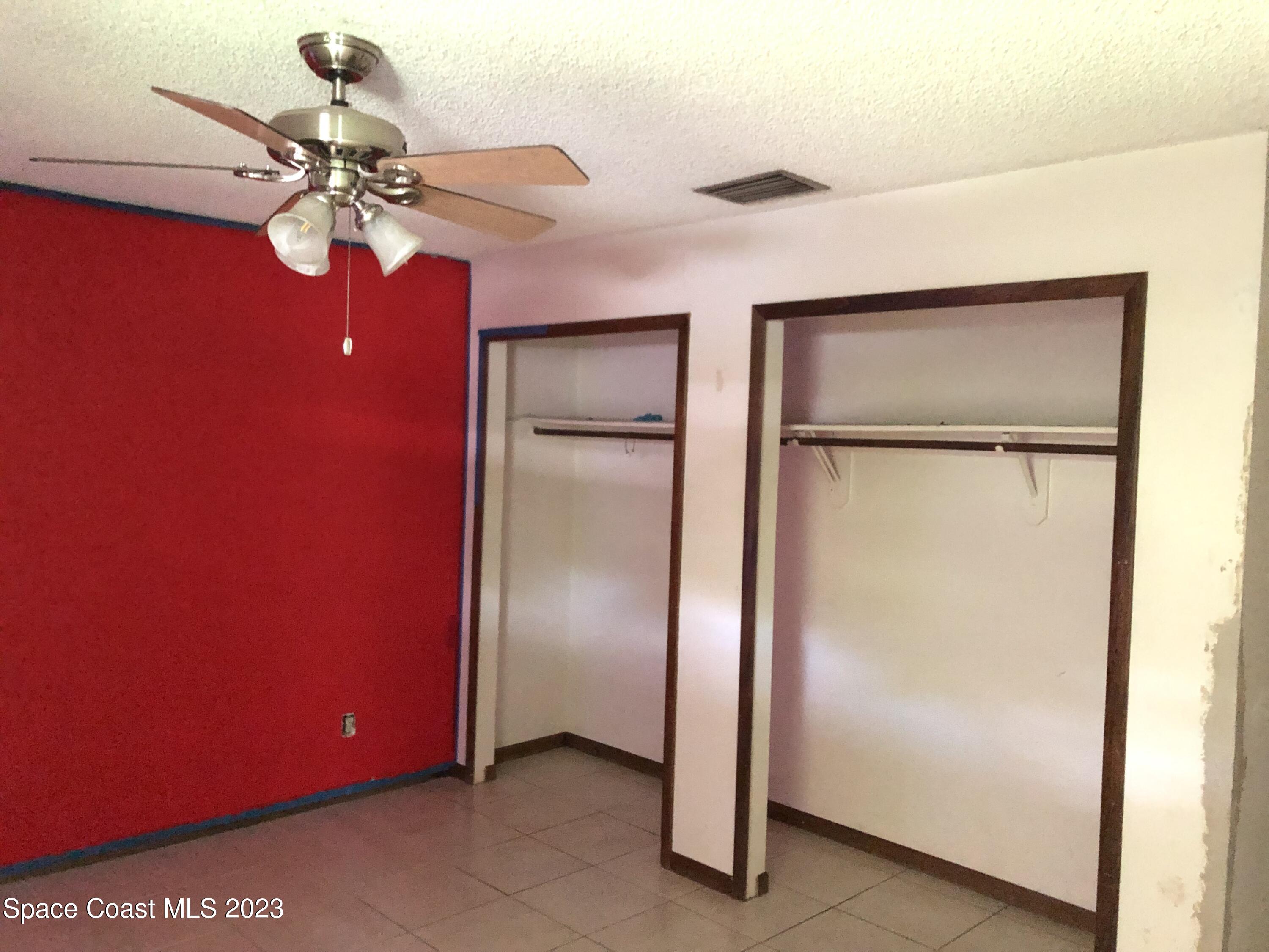 750 Fletcher Road Southeast Palm Bay, FL 32909 - Photo 8 of 12 a very nice looking room with a fan