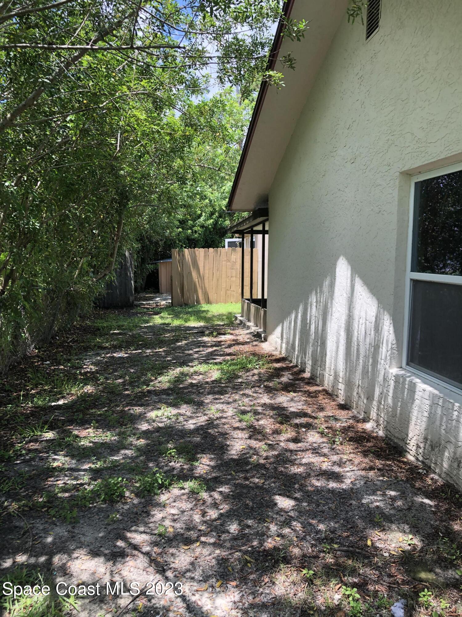 750 Fletcher Road Southeast Palm Bay, FL 32909 - Photo 10 of 12 a view of a backyard